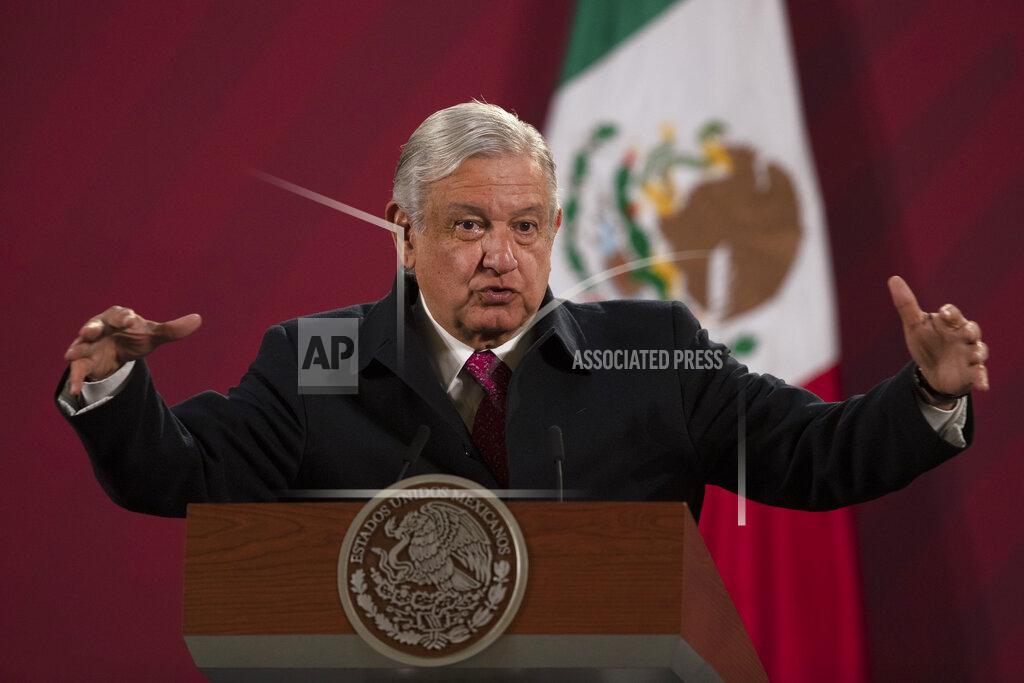 FILE - In this Dec. 18, 2020 file photo, Mexican President Andres Manuel Lopez Obrador gives his daily, morning news conference at the presidential palace, Palacio Nacional, in Mexico City. Mexico President Andrés Manuel López Obrador says he has tested positive for COVID-19 and is under medical treatment, Sunday, Jan. 24, 2021. (AP Photo/Marco Ugarte, File)