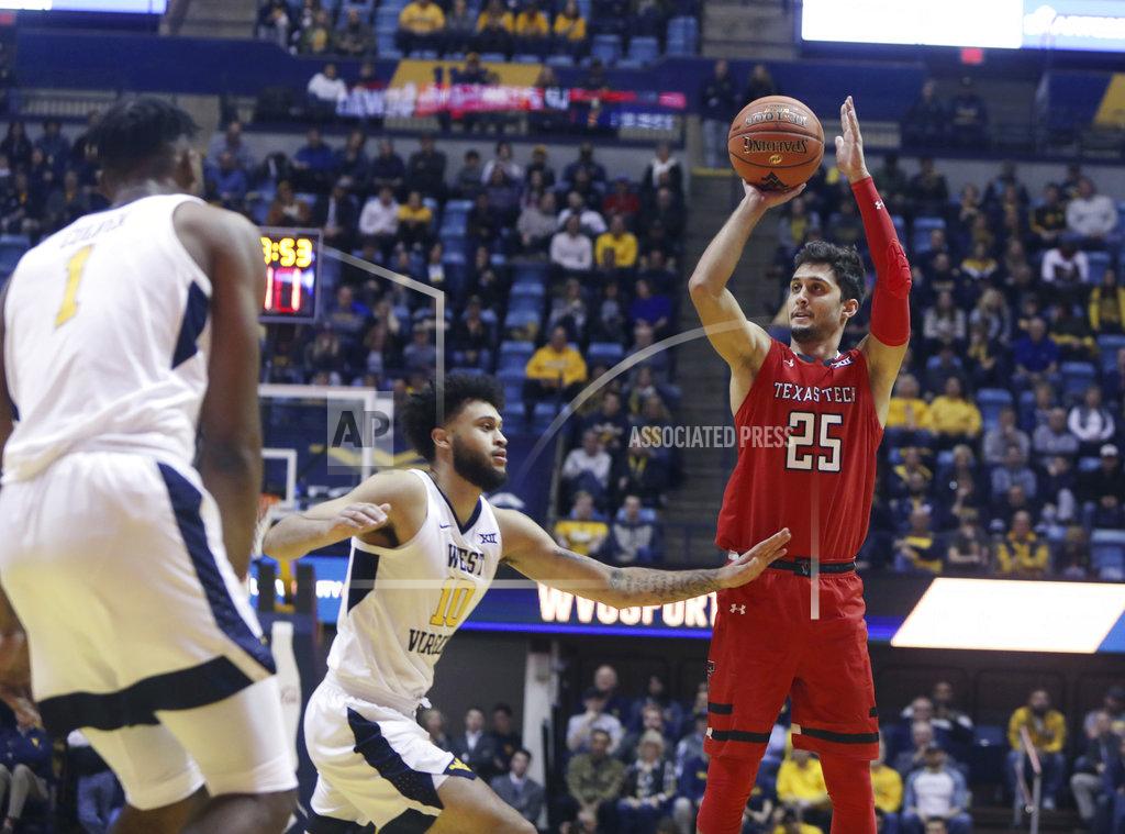 Ray Thompson Texas Tech guard Davide Moretti (25) shoots while defended by West Virginia guard Jermaine Haley (10) during the first half of an NCAA college basketball game Wednesday, Jan. 2, 2019, in Morgantown, W.Va. (AP Photo/Raymond Thompson)
