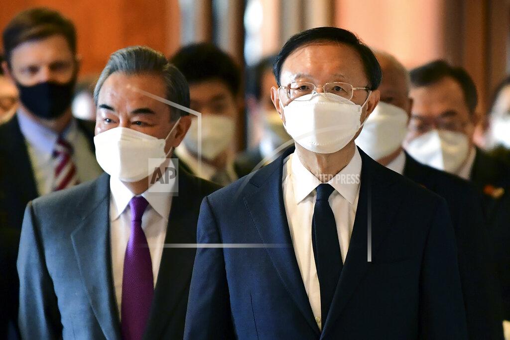 Frederic J. Brown Chinese Communist Party foreign affairs chief Yang Jiechi, right, and China's State Councilor Wang Yi, left, arrive for the opening session of US-China talks at the Captain Cook Hotel in Anchorage, Alaska, Thursday, March 18, 2021. (Frederic J. Brown/Pool via AP)