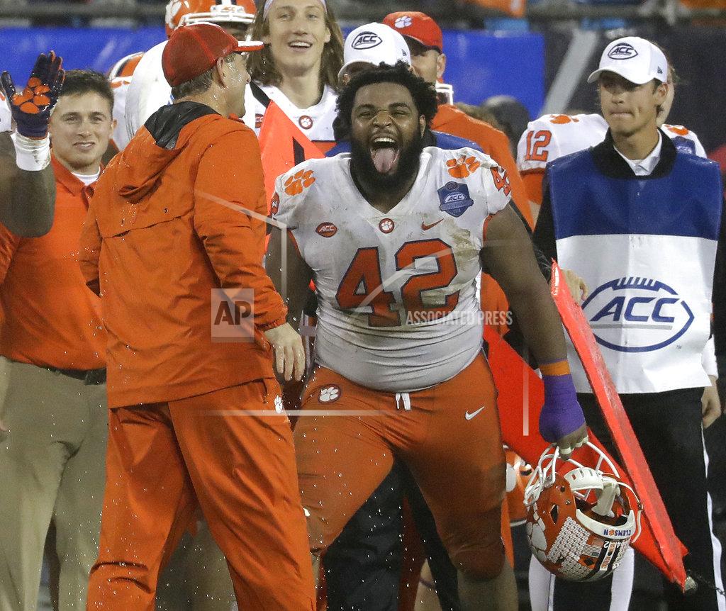 Chuck Burton FILE - In this Saturday, Dec. 1, 2018, file photo, Clemson's Christian Wilkins (42) laughs with head coach Dabo Swinney in the closing seconds of the second half of the Atlantic Coast Conference championship NCAA college football game against Pittsburgh in Charlotte, N.C. Swinney keeps the mood light around his football program. He wants the Tigers to celebrate each victory and enjoy what it takes to get there. (AP Photo/Chuck Burton, File)