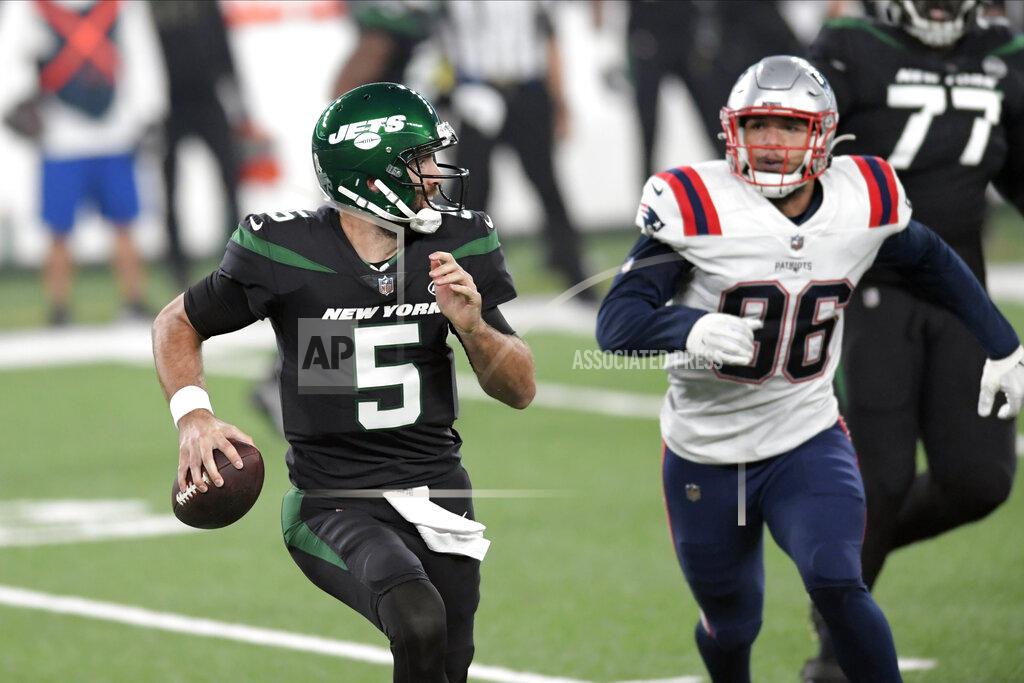 Bill Kostroun New York Jets quarterback Joe Flacco, left, looks to throw during the first half of an NFL football game against the New England Patriots, Monday, Nov. 9, 2020, in East Rutherford, N.J. (AP Photo/Bill Kostroun)