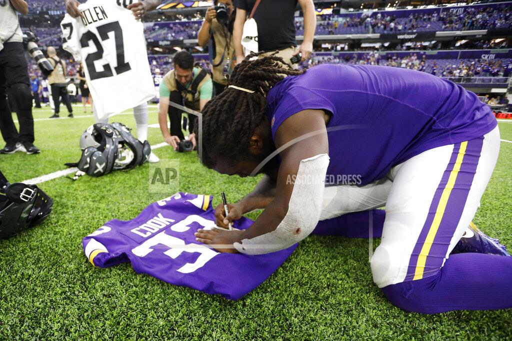 Bruce Kluckhohn Minnesota Vikings running back Dalvin Cook autographs a jersey after an NFL football game against the Oakland Raiders, Sunday, Sept. 22, 2019, in Minneapolis. The Vikings won 34-14. (AP Photo/Bruce Kluckhohn)