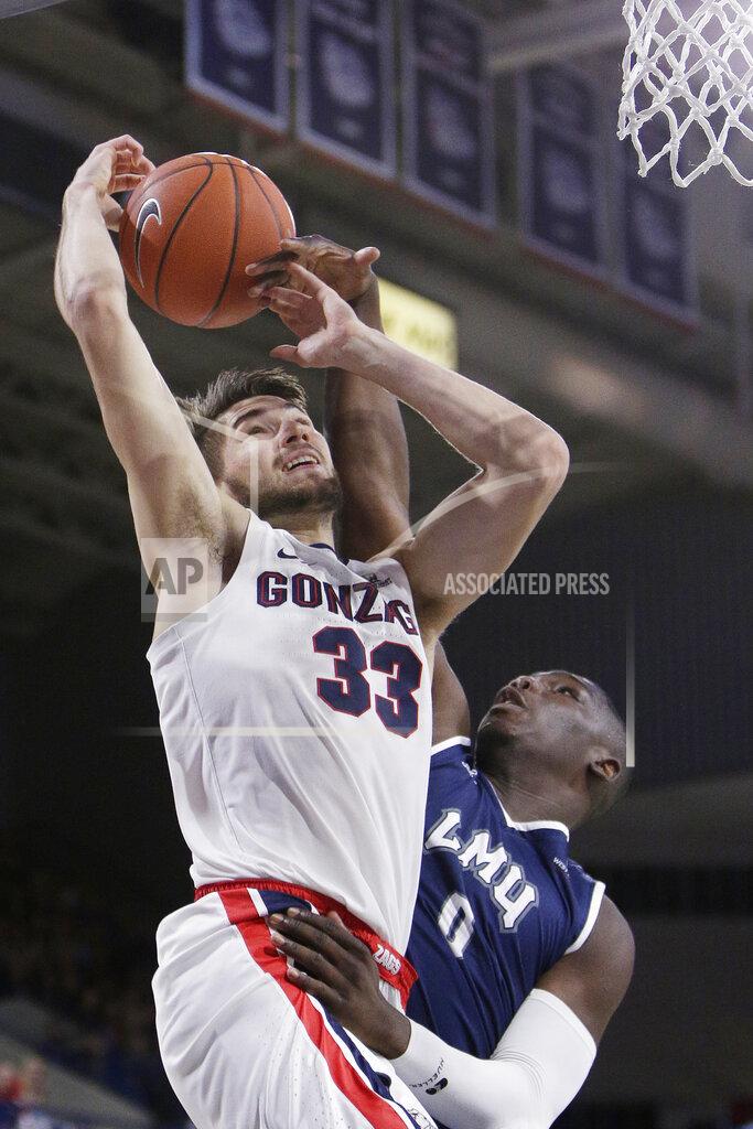 Young Kwak Gonzaga forward Killian Tillie (33) is fouled by Loyola Marymount forward Eli Scott (0) during the second half of an NCAA college basketball game in Spokane, Wash., Thursday, Jan. 17, 2019. Gonzaga won 73-55. (AP Photo/Young Kwak)