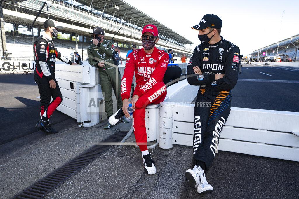 Michael Conroy Oliver Askew, right, talks with Marcus Ericsson, of Sweden, before practice for the Indianapolis 500 auto race at Indianapolis Motor Speedway in Indianapolis, Friday, Aug. 21, 2020. The 104th running of the Indianapolis 500 auto race is scheduled to run on Sunday.(AP Photo/Michael Conroy)