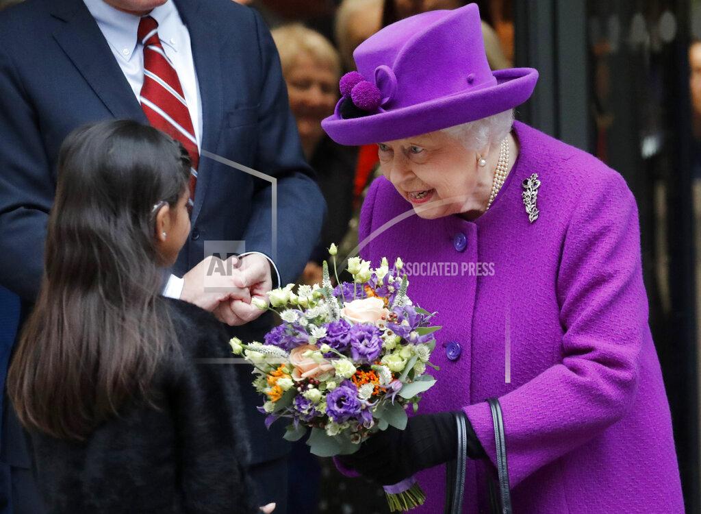 Frank Augstein FILE - Britain's Queen Elizabeth II receives flowers as she leaves after the officially opening of the new premises of the Royal National ENT and Eastman Dental Hospitals in London, on Feb. 19, 2020.(AP Photo/Frank Augstein, File)