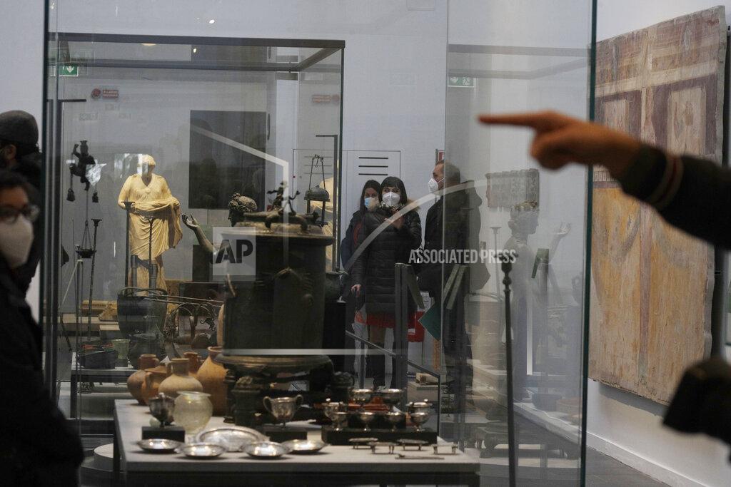 Gregorio Borgia Journalists visit the museum Antiquarium, in Pompeii, southern Italy, Monday, Jan. 25, 2021. Decades after suffering bombing and earthquake damage, Pompeii's museum is back in business, showing off exquisite finds from excavations of the ancient Roman city. Officials of the archaeological park of the ruins of the city destroyed in 79 A.D. by the eruption of Mount Vesuvius inaugurated the museum on Monday. (AP Photo/Gregorio Borgia)