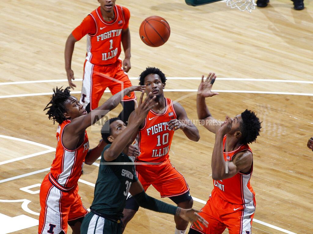 Al Goldis Illinois' Ayo Dosunmu, Michigan State's Marcus Bingham Jr. and Illinois' Andres Feliz (10) and Jermaine Hamlin, from left, vie for a rebound during the first half of an NCAA college basketball game Thursday, Jan. 2, 2020, in East Lansing, Mich. (AP Photo/Al Goldis)