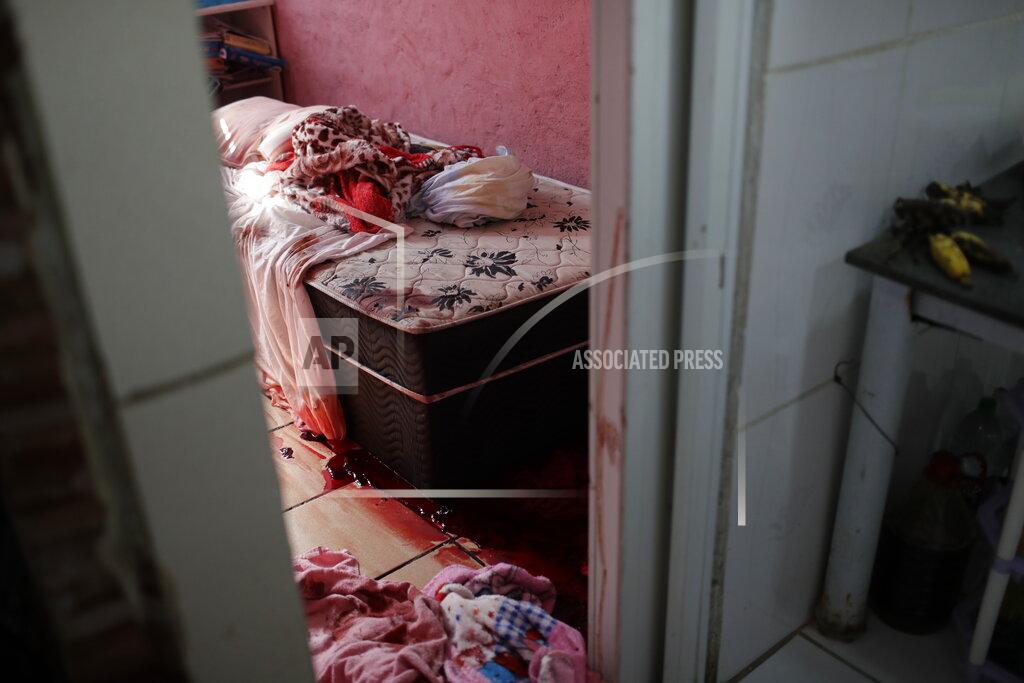 Silvia Izquierdo Blood covers the floor and a bed inside a home during a police operation targeting drug traffickers in the Jacarezinho favela of Rio de Janeiro, Brazil, Thursday, May 6, 2021. At least 25 people died including one police officer and 24 suspects, according to the press office of Rio's civil police. (AP Photo/Silvia Izquierdo)