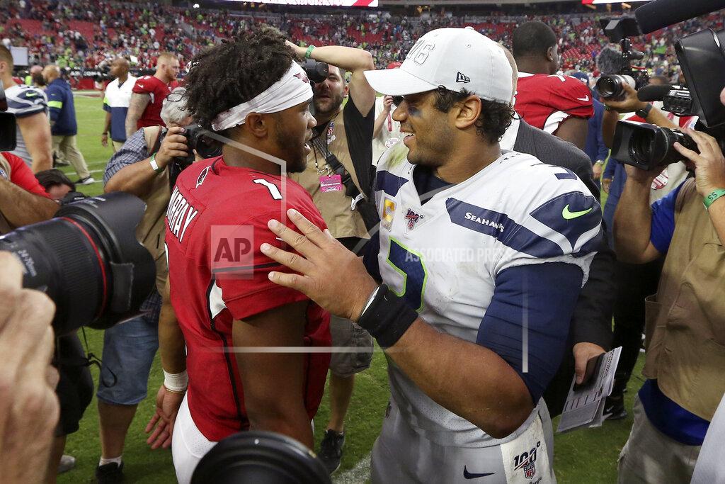 Ross D. Franklin Seattle Seahawks quarterback Russell Wilson (3), right, and Arizona Cardinals quarterback Kyler Murray (1) meet after an NFL football game, Sunday, Sept. 29, 2019, in Glendale, Ariz. The Seahawks won 27-10. (AP Photo/Ross D. Franklin)