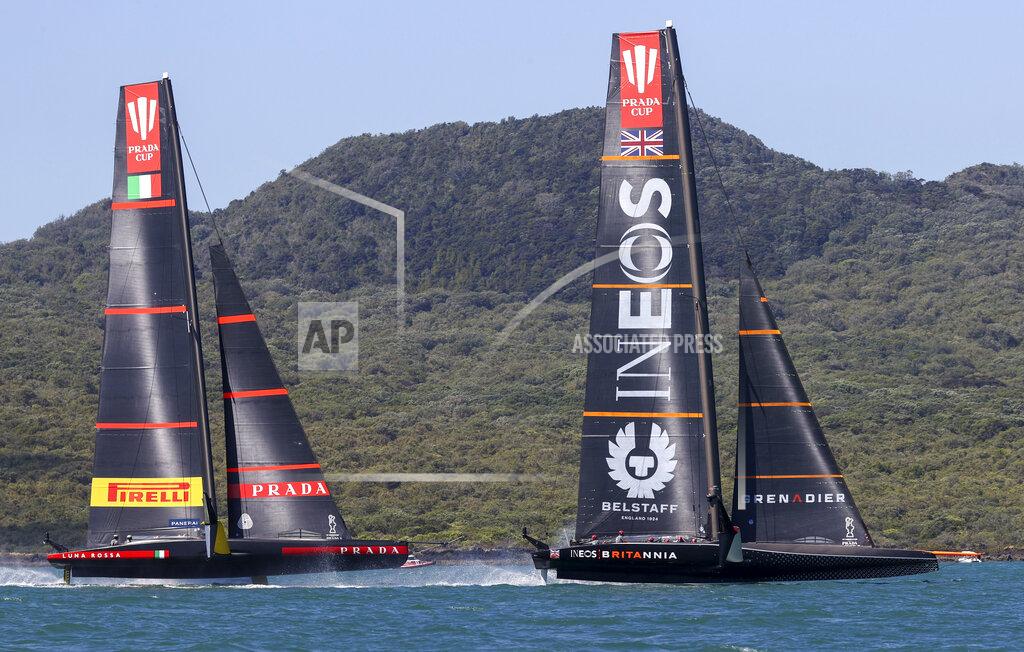 Brett Phibbs Ineos Team UK, right, leads Italy's Luna Rossa during the Prada Cup challengers series on Auckland's Waitemate Harbour, New Zealand, Friday, Jan. 15, 2021. The winner of the five week long Challenger Series goes on to challenge defenders Team New Zealand for the America's Cup from March 6 to 15. (Brett Phibbs/NZ Herald via AP)