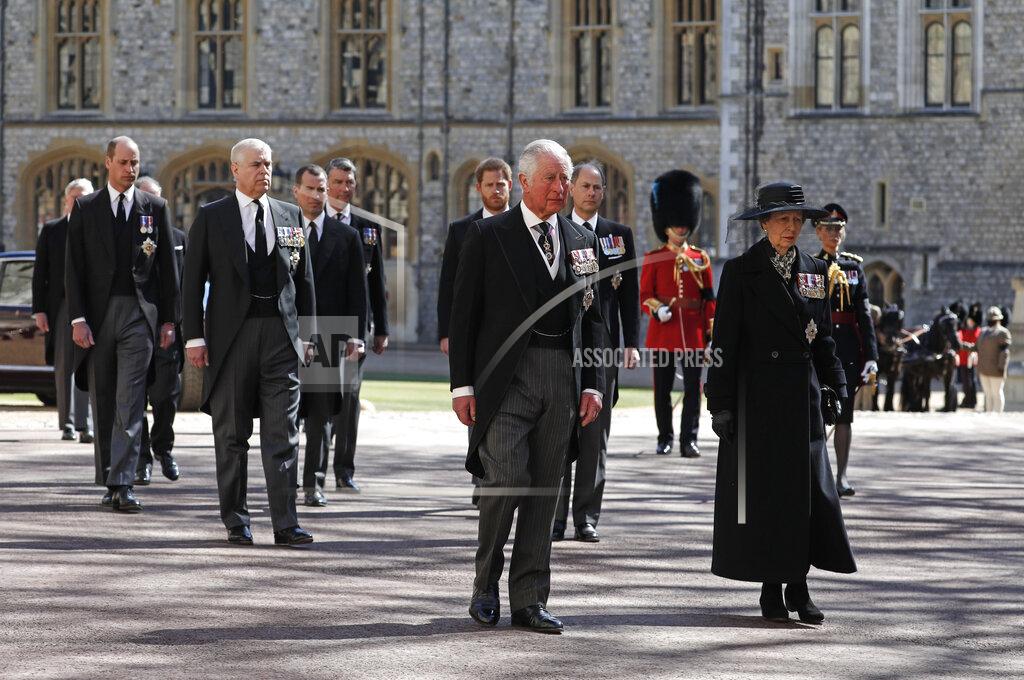Alastair Grant From front left, Britain's Prince Charles, Princess Anne, Prince Andrew. Prince Edward, Prince William, Peter Phillips, Prince Harry, Earl of Snowdon and Tim Laurence follow the coffin in a ceremonial procession for the funeral of Britain's Prince Philip inside Windsor Castle in Windsor, England Saturday April 17, 2021. Prince Philip died April 9 at the age of 99 after 73 years of marriage to Britain's Queen Elizabeth II. (Alastair Grant/Pool via AP)