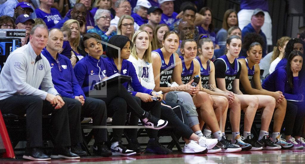 Ben Mckeown The Kansas State bench looks toward the court in the final minutes of their loss to North Carolina State in a college basketball game in the second round of the NCAA tournament in Raleigh, N.C., Monday, March 21, 2022. (AP Photo/Ben McKeown)