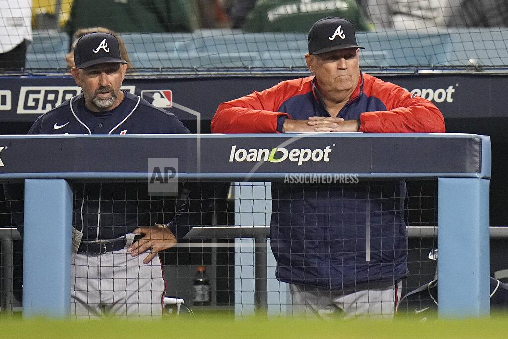 Jae C. Hong Atlanta Braves manager Brian Snitker, right, watches his team during the ninth inning against the Los Angeles Dodgers in Game 5 of baseball's National League Championship Series Thursday, Oct. 21, 2021, in Los Angeles. (AP Photo/Jae C. Hong)