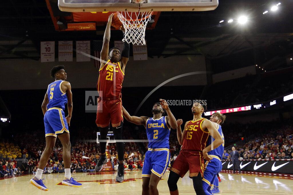 Marcio Jose Sanchez Southern California forward Onyeka Okongwu (21) dunks against UCLA during the second half of an NCAA college basketball game Saturday, March 7, 2020, in Los Angeles. (AP Photo/Marcio Jose Sanchez)