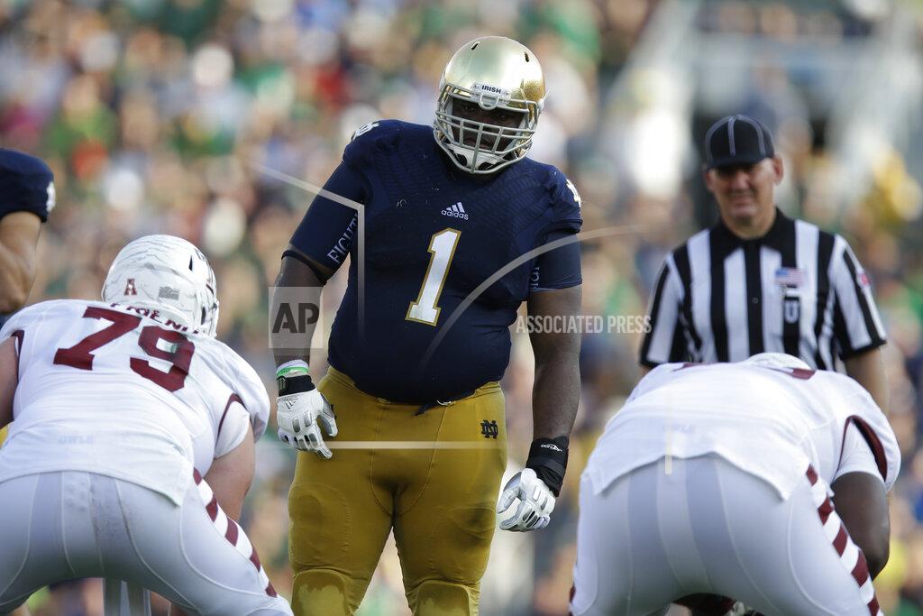 Michael Conroy FILE - In this Saturday, Aug. 31, 2013, file photo, Notre Dame defensive lineman Louis Nix III (1) prepares to get into his defensive stance during the second half of an NCAA college football game against Temple in South Bend, Ind. Nix’s mother, Stephanie Wingfield, says authorities told her that her son had died but they were unable to give her more information about his death. The Jacksonville Sheriff’s Office said in a tweet Saturday, Feb. 27, 2021, that Nix was located, but didn’t give any other details. (AP Photo/Michael Conroy, File)