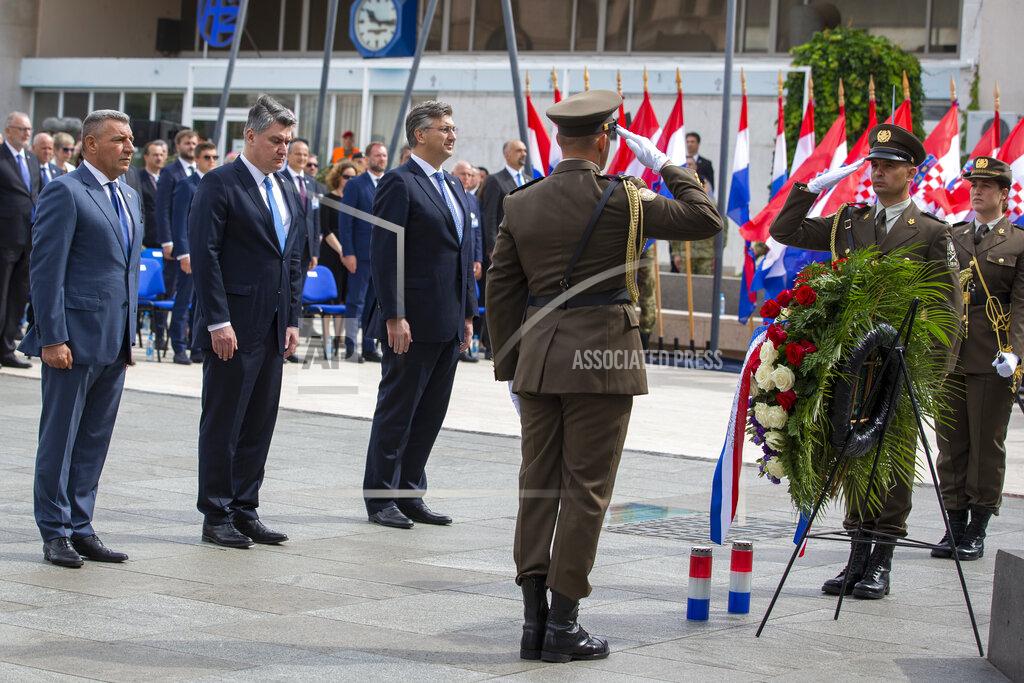 Darko Bandic From left, Gen. Ret. Ante Gotovina, Croatian President Zoran Milanovic and Prime Minister Andrej Plenkovic attend a ceremony in Knin, Croatia, Wednesday, Aug. 5, 2020. Croatia marked the 25th anniversary of a victorious wartime military offensive, with an ethnic Serb politician attending the ceremony for the first time in what is seen as an important step toward reconciliation. (AP Photo/Darko Bandic)