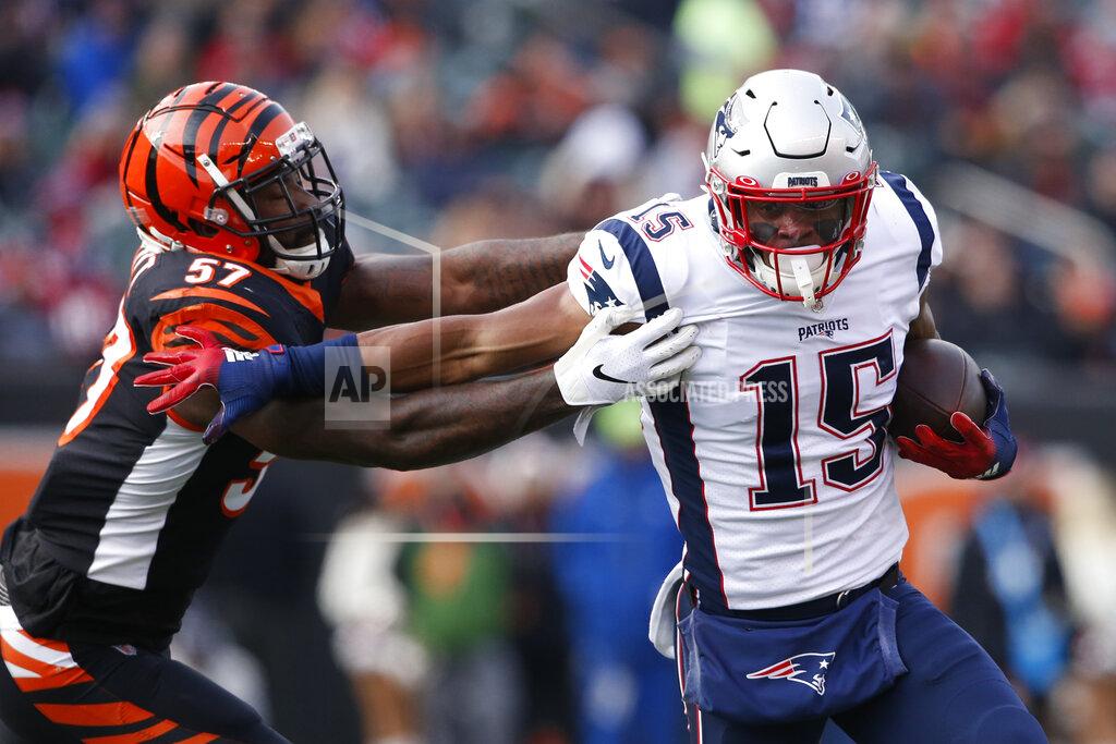 Gary Landers New England Patriots wide receiver N'Keal Harry (15) runs the ball against Cincinnati Bengals linebacker Germaine Pratt (57) in the first half of an NFL football game, Sunday, Dec. 15, 2019, in Cincinnati. (AP Photo/Gary Landers)