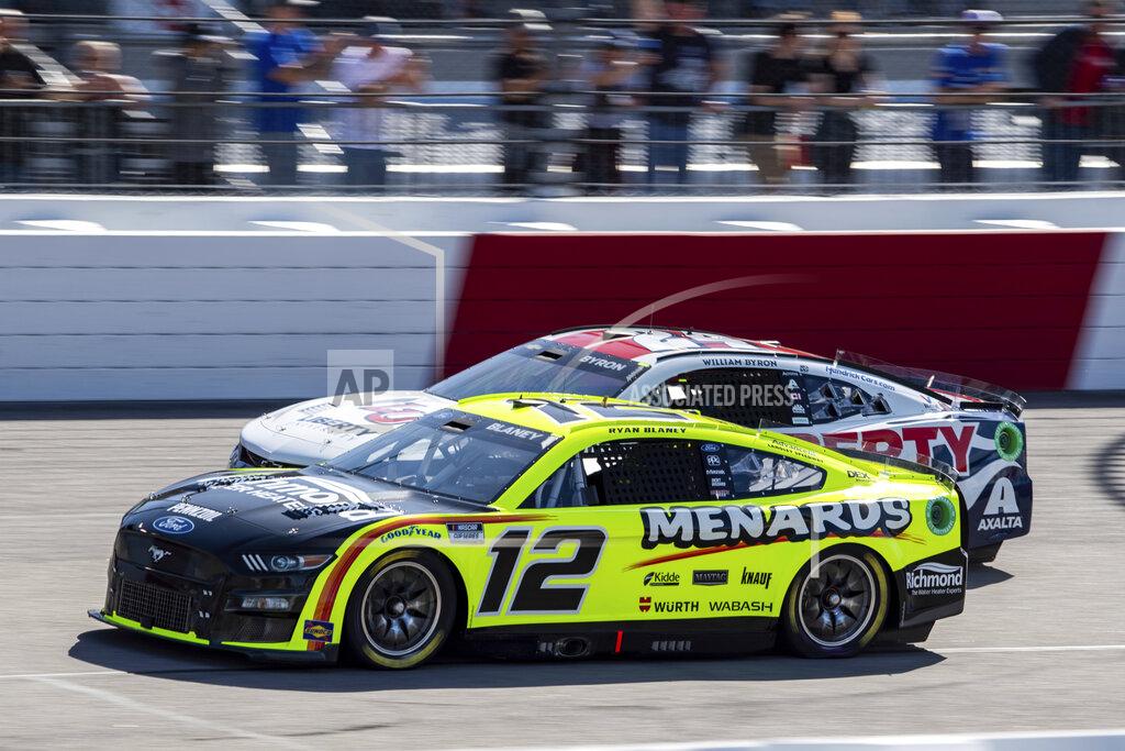 Mike Caudill Ryan Blaney (12) leads William Byron (24) during the NASCAR Cup Series auto race at Richmond Raceway on Sunday, April 3, 2022, in Richmond, Va. (AP Photo/Mike Caudill)