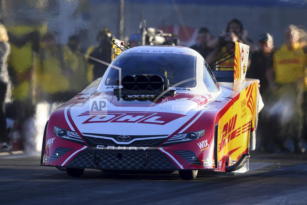 Marc Gewertz In this photo provided by the NHRA, J.R. Todd drives in Funny Car qualifying Friday, Nov. 1, 2019, at the Dodge NHRA Nationals in Las Vegas. Todd had a run of 3.856 seconds at 333.58 mph. (Marc Gewertz/NHRA via AP)
