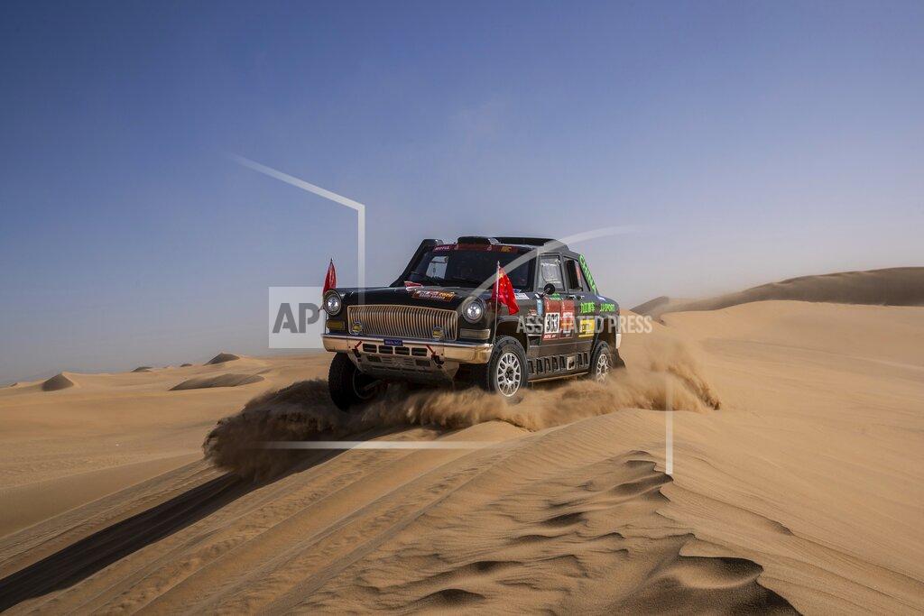 Bernat Armangue In this Monday, Jan. 13, 2020 photo, driver Quan Ruan, of China, and co-driver Yirong Wang, of China, race their Chevrolet during stage eight of the Dakar Rally in Wadi Al Dawasir, Saudi Arabia. Formerly known as the Paris-Dakar Rally, the race was created by Thierry Sabine after he got lost in the Libyan desert in 1977. Until 2008, the rallies raced across Africa, but threats in Mauritania led organizers to cancel that year's event and move it to South America. It has now shifted to Saudi Arabia. The race started on Jan. 5 with 560 drivers and co-drivers, some on motorbikes, others in cars or in trucks. Only 41 are taking part in the Original category. (AP Photo/Bernat Armangue)
