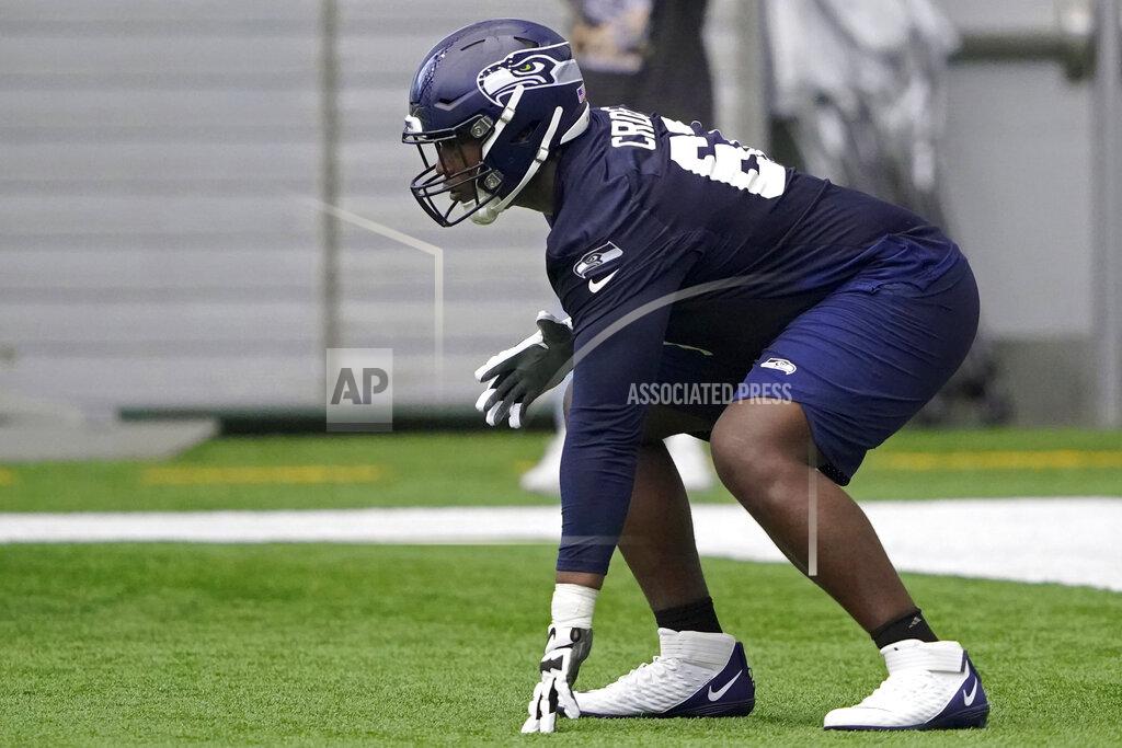 Ted S. Warren Seattle Seahawks offensive tackle Charles Cross gets set in a three-point stance during NFL football rookie minicamp Friday, May 6, 2022, in Renton, Wash. (AP Photo/Ted S. Warren)