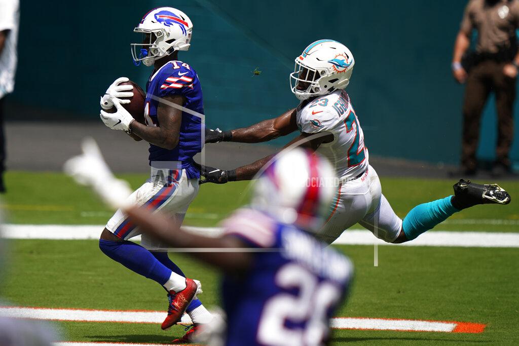 Wilfredo Lee Buffalo Bills wide receiver Stefon Diggs (14) scores a touchdown as Miami Dolphins cornerback Noah Igbinoghene (23) attempts to tackle, during the first half of an NFL football game, Sunday, Sept. 20, 2020 in Miami Gardens, Fla. (AP Photo/Wilfredo Lee)