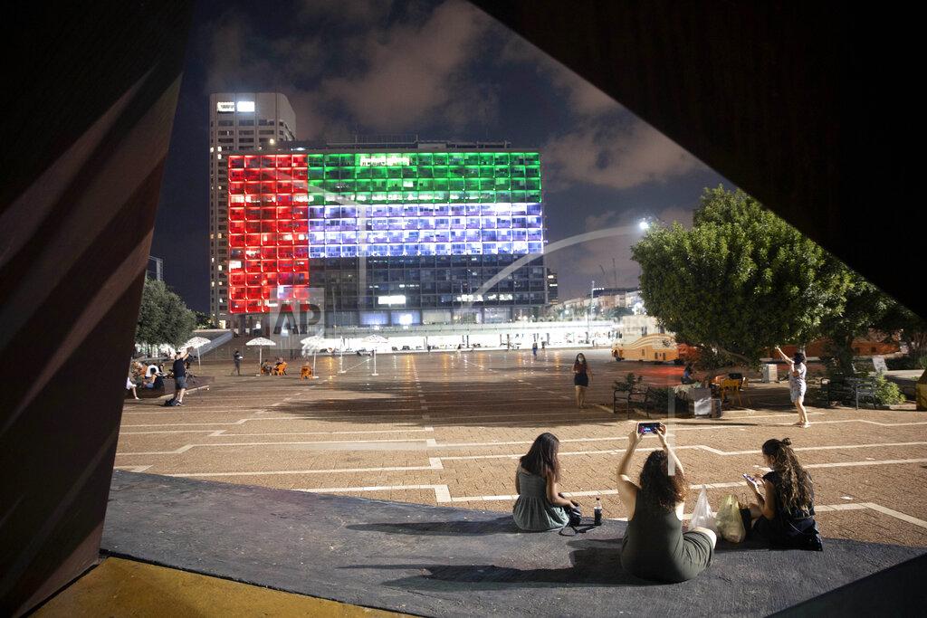 Oded Balilty Tel Aviv City Hall is lit up with the flags of the United Arab Emirates and Israel as the countries announced they would be establishing full diplomatic ties, in Tel Aviv, Israel, Thursday, Aug. 13, 2020. In a nationally broadcast statement, Prime Minister Benjamin Netanyahu said the "full and official peace" with the UAE would lead to cooperation in many spheres between the countries and a "wonderful future" for citizens of both countries. (AP Photo/Oded Balilty)