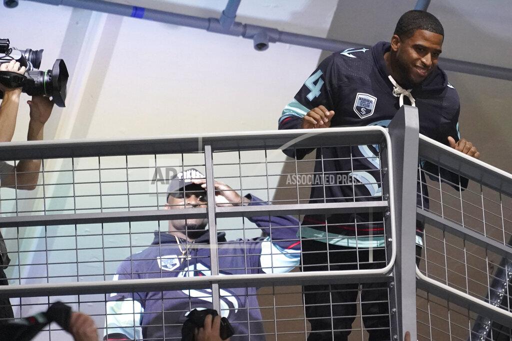 Ted S. Warren Seattle Seahawks' Bobby Wagner, right, and DK Metcalf, left, are introduced during an NHL hockey game between the Seattle Kraken and the Vancouver Canucks, Saturday, Oct. 23, 2021, in Seattle. (AP Photo/Ted S. Warren)