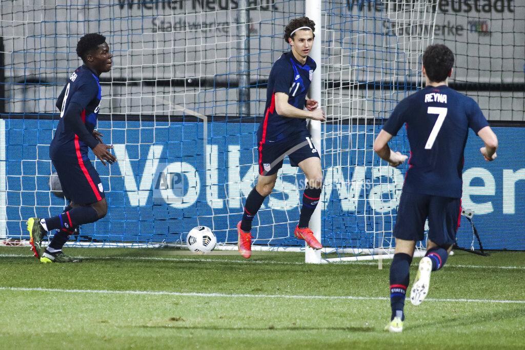 Ronald Zak US players celebrate after scoring their second goal during the international friendly soccer match between USA and Jamaica at SC Wiener Neustadt stadium in Wiener Neustadt, Austria, Thursday, March 25, 2021. (AP Photo/Ronald Zak)
