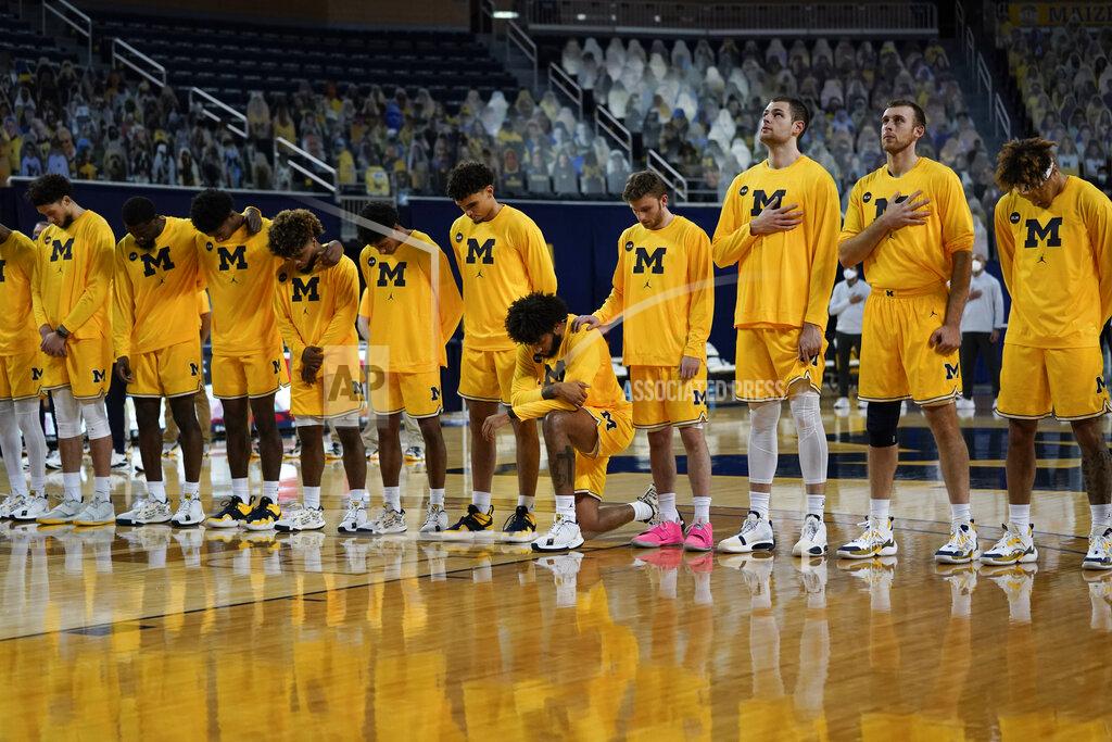 Paul Sancya Michigan forward Isaiah Livers kneels during the national anthem before an NCAA college basketball game against Toledo in Ann Arbor, Mich., Wednesday, Dec. 9, 2020. (AP Photo/Paul Sancya)