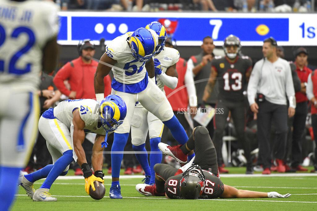 Kevork Djansezian Tampa Bay Buccaneers tight end Rob Gronkowski (87) lays on the ground after being hit by Los Angeles Rams linebacker Terrell Lewis (52) during the second half of an NFL football game Sunday, Sept. 26, 2021, in Inglewood, Calif. (AP Photo/Kevork Djansezian)