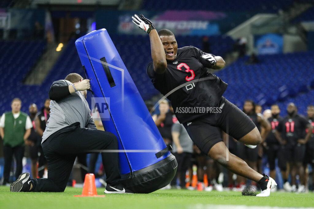 Michael Conroy FILE - In this Feb. 29, 2020, file photo, Auburn defensive lineman Derrick Brown runs a drill at the NFL football scouting combine in Indianapolis. Atlanta Falcons coach Dan Quinn says the NFC South “is turning into Quarterback South.” The priority to “bring it” on defense was evident in the NFL draft. (AP Photo/Michael Conroy, File)