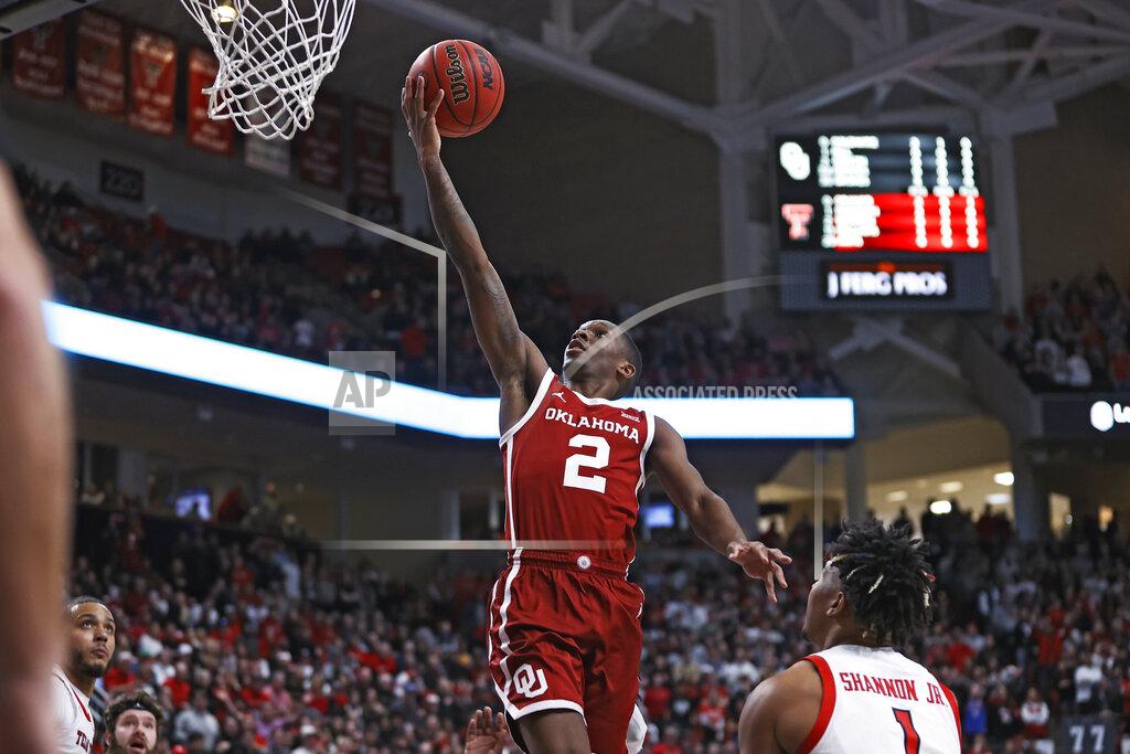 Brad Tollefson Oklahoma's Umoja Gibson (2) lays up the ball during the first half of the team's NCAA college basketball game against Texas Tech, Tuesday, Feb. 22, 2022, in Lubbock, Texas. (AP Photo/Brad Tollefson)