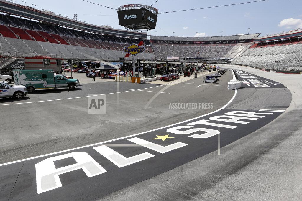 Mark Humphrey Work goes on in the infield behind an All-Star Race logo before the NASCAR All-Star auto race at Bristol Motor Speedway in Bristol, Tenn, Wednesday, July 15, 2020. (AP Photo/Mark Humphrey)