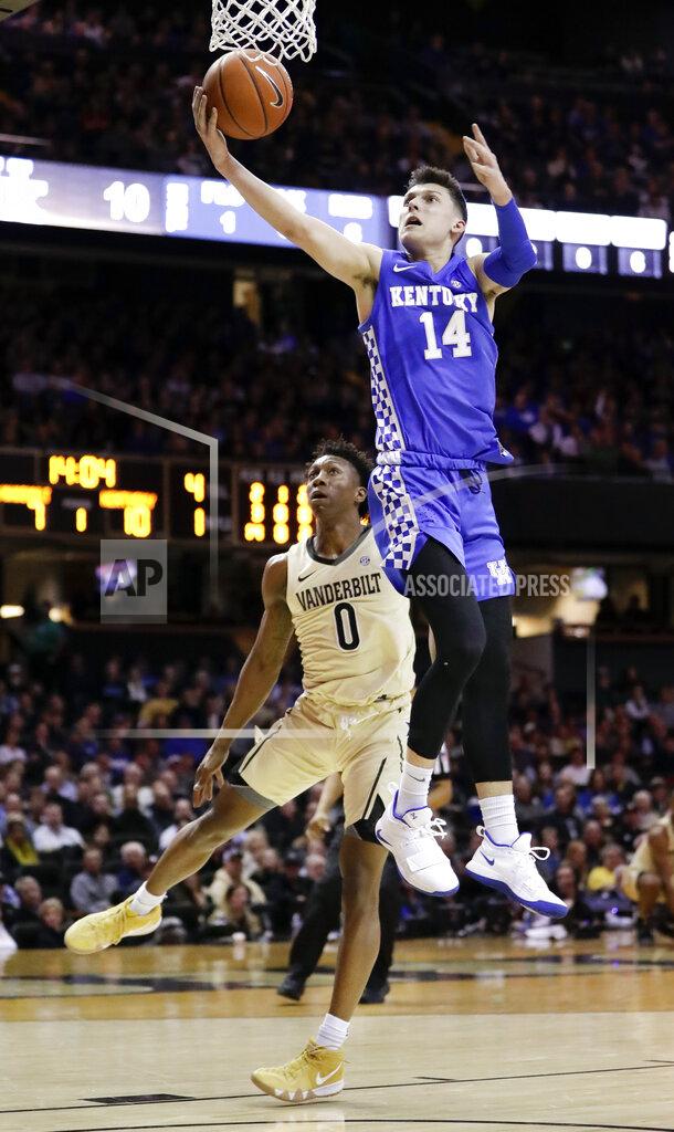 Mark Humphrey Kentucky guard Tyler Herro (14) scores in front of Vanderbilt guard Saben Lee (0) in the first half of an NCAA college basketball game Tuesday, Jan. 29, 2019, in Nashville, Tenn. (AP Photo/Mark Humphrey)