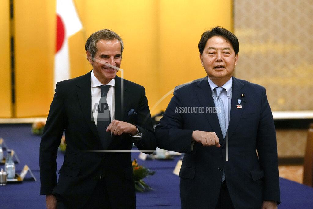 Hiro Komae Director-General of the International Atomic Energy Agency (IAEA) Rafael Grossi, left, and Japanese Foreign Minister Yoshimasa Hayashi pose for a photo before their talk at the Iikura guesthouse in Tokyo, Thursday, May 19, 2022. (AP Photo/Hiro Komae)