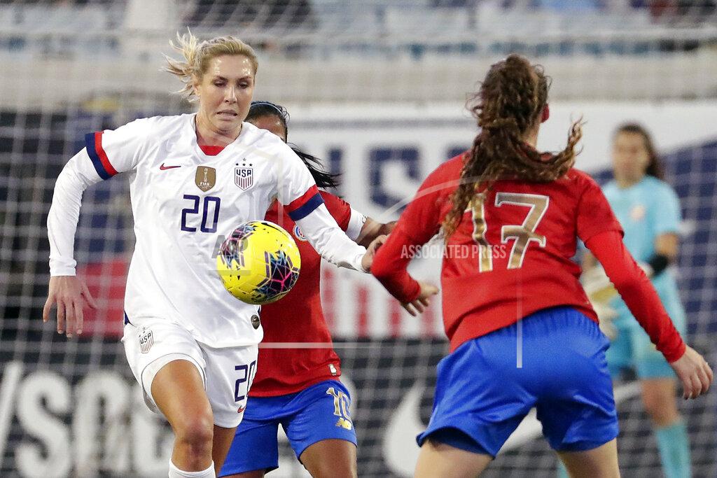 John Raoux FILE - In this Sunday, Nov. 10, 2019 file photo, U.S. midfielder Allie Long (20) goes after the ball in front of Costa Rica forward Maria Paula Salas (17) during the second half of an international friendly soccer match in Jacksonville, Fla. Allie Long is likely the only National Women’s Soccer League Player that launched a new career while sheltering at home. Long has been playing video games on Twitch and has built a solid reputation in the gaming world – so much so that she’s been able to raise some serious money for charities, while also educating fellow gamers about women’s soccer. (AP Photo/John Raoux, File)