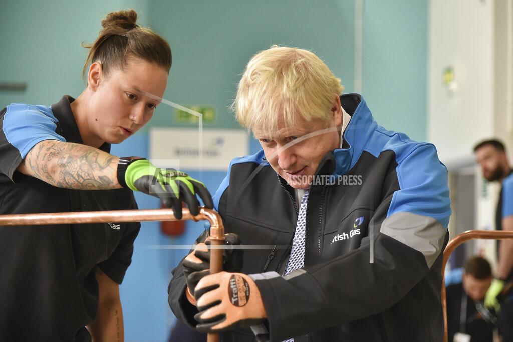 Rui Vieira Britain's Prime Minister Boris Johnson listens to apprentice Amy Gray during a visit to a British Gas training academy in Leicestershire, England, Monday, Sept. 13, 2021.(AP Photo/Rui Vieira, Pool)