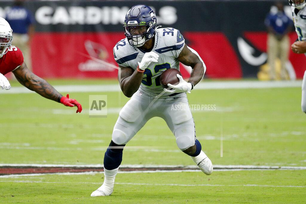 Rick Scuteri Seattle Seahawks running back Chris Carson (32) runs the ball against the Arizona Cardinals during the first half of an NFL football game, Sunday, Sept. 29, 2019, in Glendale, Ariz. (AP Photo/Rick Scuteri)