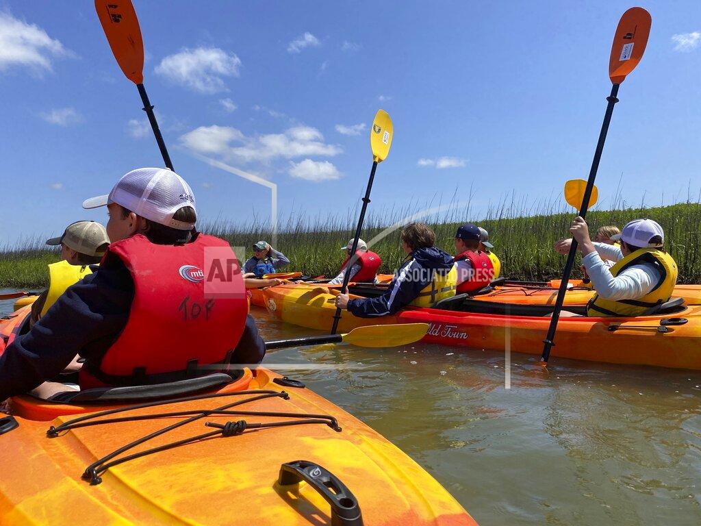 Sarah Haselhorst Hilton Head Christian Academy seventh graders kayaking out on Broad Creek to learn about the environment around them and how to protect it Monday, May 9, 2022 on Hilton Head Island. (Sarah Haselhorst/The Island Packet via AP)