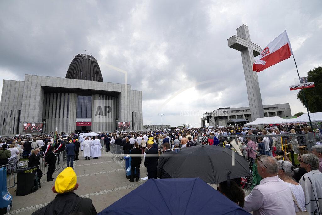 Czarek Sokolowski Catholic faithful attend the beatification ceremony of Polish Cardinal Stefan Wyszynski and Mother Elzbieta Roza Czacka in front of the church of Providence in Warsaw, Poland, Sunday, Sept. 12, 2021. Poland's top political leaders gathered in a Warsaw church Sunday for the beatification of two revered figures of the Catholic church — a cardinal who led the Polish church's resistance to communism and a blind nun who devoted her life to helping others who couldn't see. (AP Photo/Czarek Sokolowski)