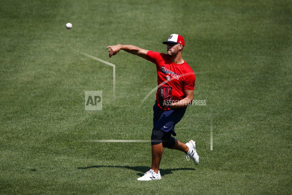 Carolyn Kaster Washington Nationals pitcher Tanner Rainey throws during a baseball training camp workout at Nationals Stadium, Sunday, July 5, 2020, in Washington. (AP Photo/Carolyn Kaster)