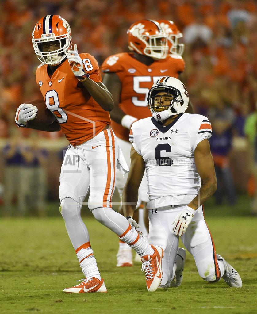 Clemson wide receiver Deon Cain (8) gestures after a catch as Auburn defensive back Carlton Davis (6) reacts during the second half of an NCAA college football game, Saturday, Sept. 9, 2017, in Clemson, S.C. (AP Photo/Rainier Ehrhardt)