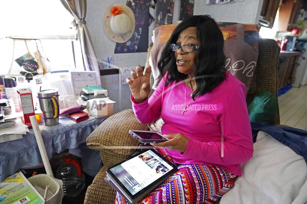 Mary Christian, 71, of McComb, Miss., recalls Friday, Jan. 15, 2021, the hours she spent on both her cell phone and iPad trying to arrange an appointment online for a COVID-19 vaccination through the Mississippi State Department of Health web site and on their listed registration phone line. Eventually, with help from one of her sons, she was able to enter the registration site only to find vaccination locations with openings were at least an hour's drive from the county she lives in and upon trying to sign up was informed they had no more openings. (AP Photo/Rogelio V. Solis)