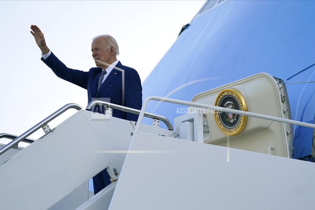 Evan Vucci U.S. President Joe Biden waves before he boards Air Force One at Yokota Air Base in Fussa, Japan, Tuesday, May 24, 2022. (AP Photo/Evan Vucci)