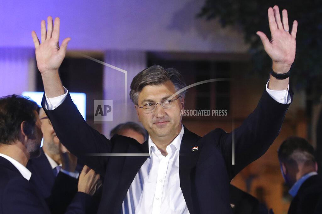 Uncredited Andrej Plenkovic, Croatia's Prime Minister incumbent celebrates with his party members in Zagreb, Croatia, Sunday, July 5, 2020. The ruling conservatives overwhelmingly won Croatia's parliamentary elections held Sunday amid a spike in new coronavirus cases as the latest European Union member state leaned further to the right. (AP Photo)