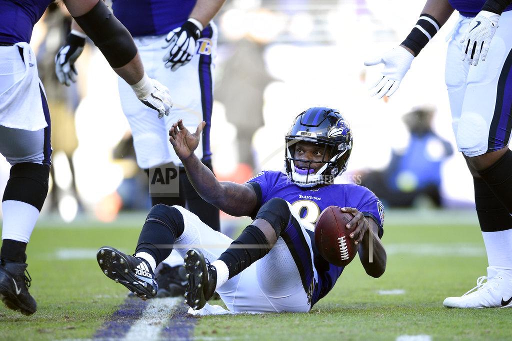 Nick Wass Teammates help Baltimore Ravens quarterback Lamar Jackson to his feet after a play in the second half of an NFL wild card playoff football game against the Los Angeles Chargers, Sunday, Jan. 6, 2019, in Baltimore. (AP Photo/Nick Wass)