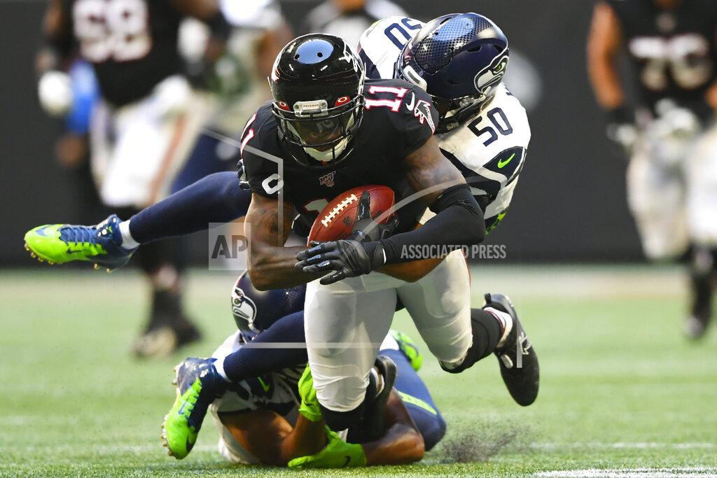 John Amis Seattle Seahawks outside linebacker K.J. Wright (50) tackles Atlanta Falcons wide receiver Julio Jones (11) during the second half of an NFL football game, Sunday, Oct. 27, 2019, in Atlanta. (AP Photo/John Amis)