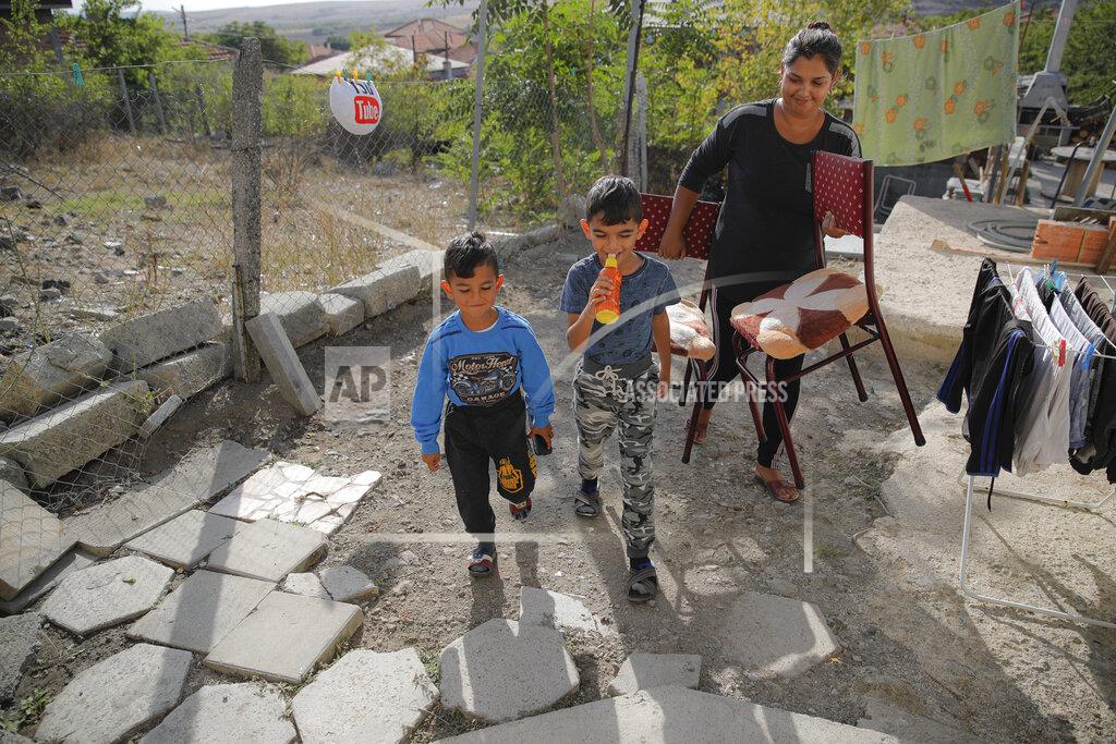 Vadim Ghirda Bulgarian Roma children of the Topchu family walk in a village on the outskirts of Burgas, Bulgaria, Monday, Sept. 28, 2020. (AP Photo/Vadim Ghirda)