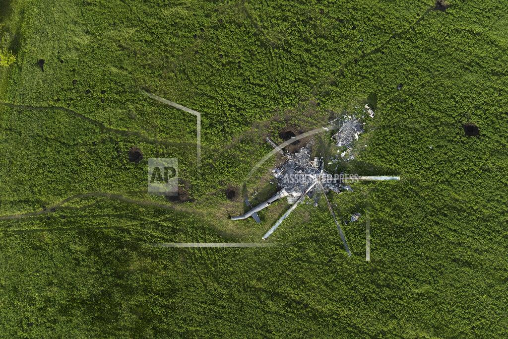 Bernat Armangue The remains of a destroyed Russian helicopter lie in a field in the village of Malaya Rohan, Kharkiv region, Ukraine, Monday, May 16, 2022. (AP Photo/Bernat Armangue)